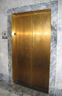 The bright brass elevator doors in the building make them easy to find