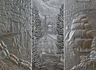 Carved bronze doors on the Legislative Building with a school, farmers, a tall ship and other Northwest scenes.