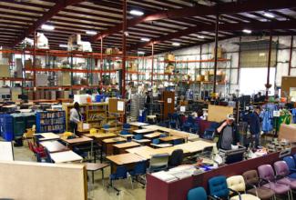 Inside the Surplus retail store, with furniture, electronics and other items.