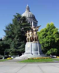 Winged Victory monument with the Capitol Building in the background