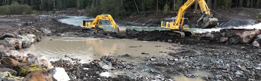 Construction equipment working in river