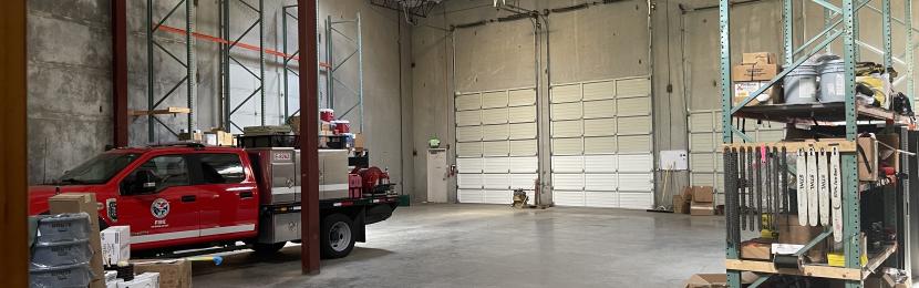 Warehouse with fire engine parked inside