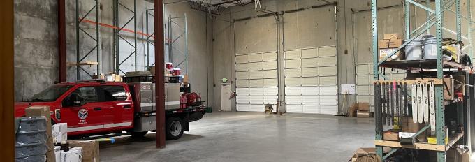 Warehouse with fire engine parked inside